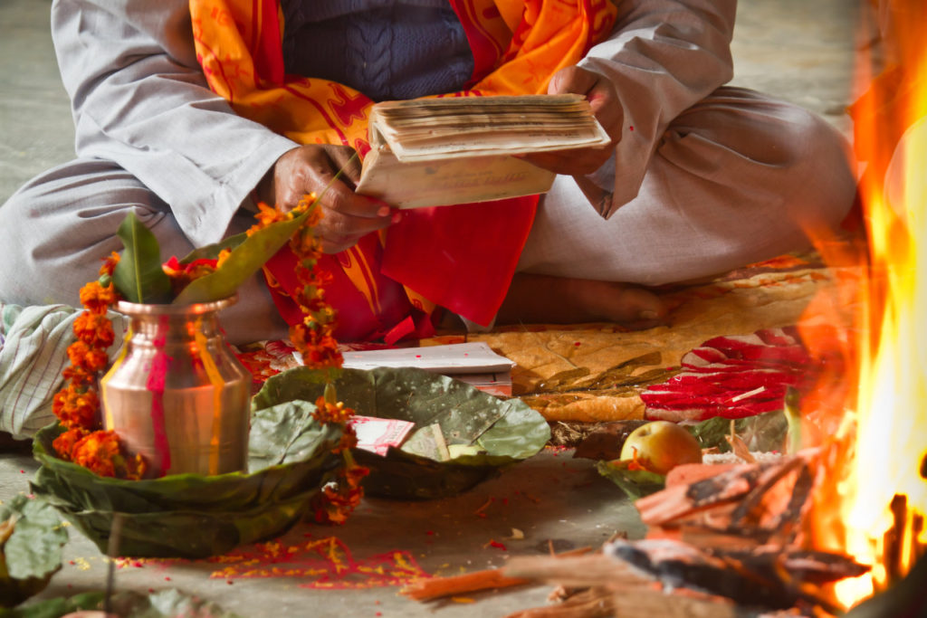 Brahmin reading hindu mantra in Nepal