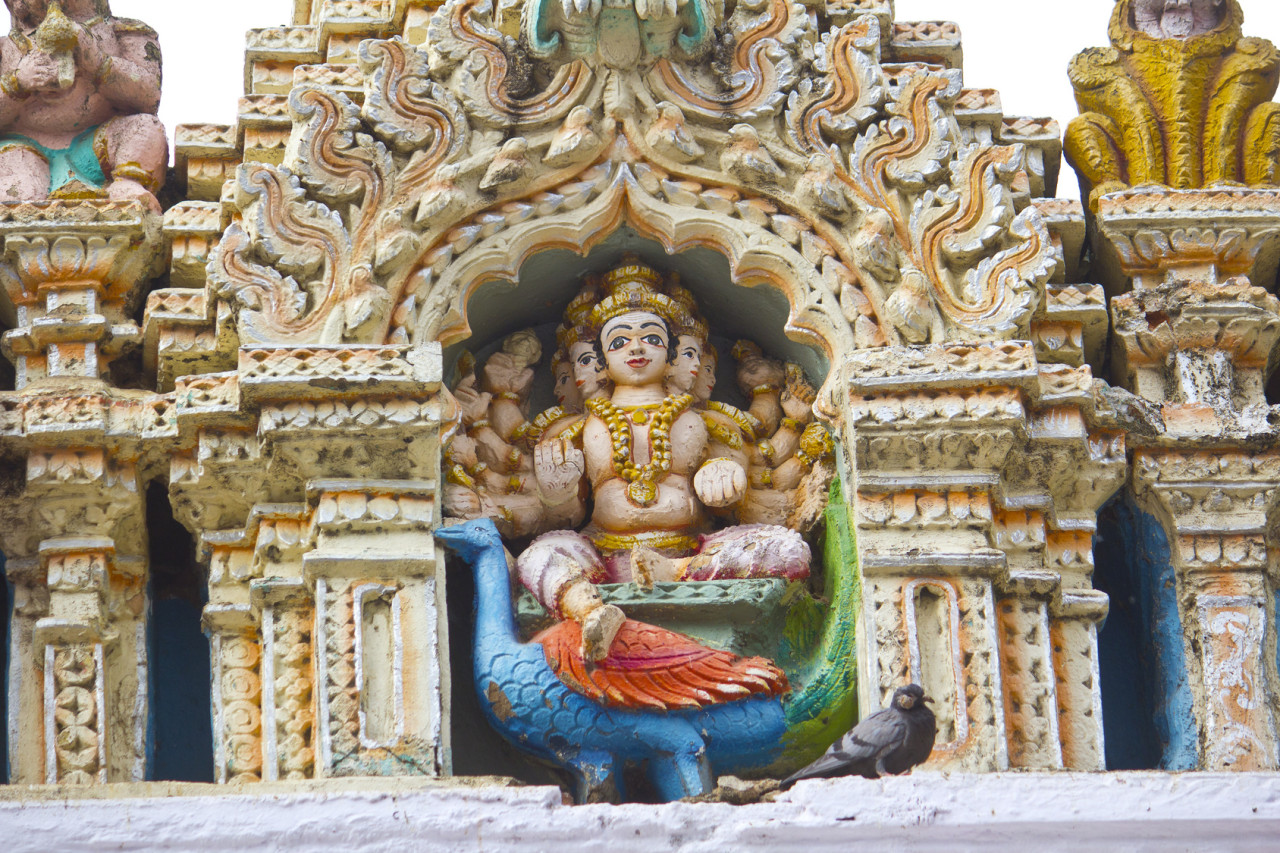 Sculpture of the Hindu God Skanda, or Kartikkeya, or Murugan, son of Shiva, on the wall of the famous ancient Bull temple in Bangalore