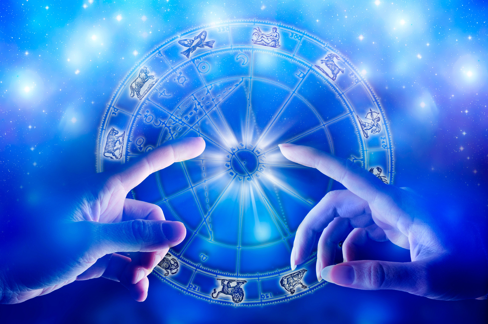 man and woman in romantic touch over a zodiac chart, concept of finding love with astrology