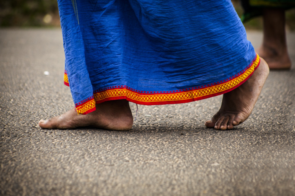 Feet of indian man in traditional clothes